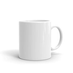 a white coffee mug sitting on top of a table