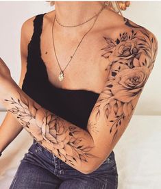 a woman with tattoos on her arms and arm