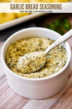 garlic bread seasoning in a white bowl with a spoon