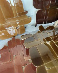 many different shapes and sizes of glass tiles