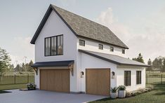 a white house with two brown garage doors on it's side and grass in the front yard