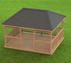 a small wooden gazebo in the middle of some green grass with a black roof