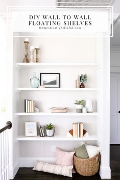 a white bookshelf filled with lots of different items