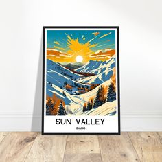 the sun valley ski resort poster is displayed in front of a white wall and wooden floor