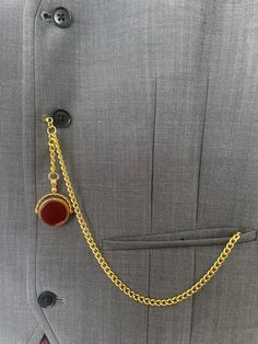 single albert gold plated colour. pocket watch chain with vintage type fob    swivels rotates with  real stones   Natural blood red stone on one side and black  stone on the other side  around 39mm long by 30mm wide made of stainless steel Please note  waistcoats are for display only not for sale From t bar to the end of clasps is over 34 cm over 13inch long .times to T bar 35mm long .over 1,1/4 inch long    gold in colour chain 5mm wide  From the t bar to the end of the fob chain 9.cm long  T b Classic Metal Pocket Watch For Formal Occasions, Elegant Black Pocket Watch For Formal Occasions, Gold Pocket Watch With Chain For Formal Occasions, Peter Core, Trouser Pocket, Pocket Watch Chain, Vintage Type, Long T, Pocket Watches