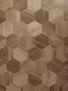 an image of wood tiles that look like hexagonals on the wall or floor