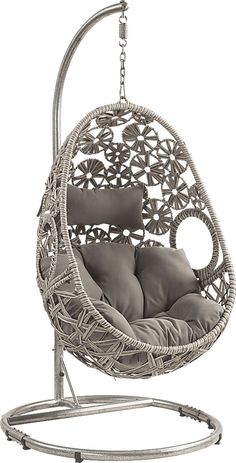 a white hanging chair with grey cushions