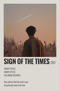 a person standing in front of a field with the words sign of the times on it