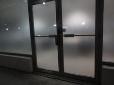 frosted glass doors in an office building with no one inside or outside the door