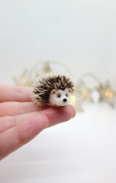 Button the hedgehog, miniature needle felted animal Meet Button, he is a sweet and tiny hedgehog. Made from wool and mohair. Needle felting is a long process of stabbing wool fibers with a special barbed needle. The wool interlocks together and becomes a solid sculpture. Button is approx. 5 cm long and 2,5 cm tall. He will be a great gift for any nature lover. Made with love and with great care and attention to the details. You will get a very similar looking hedgehog. Made to order. I will need Tiny Hedgehog, Handmade Animals, Felt Snowman, Needle Felting Diy, Wool Animals, Felt Mouse, Diy Paper Crafts Decoration, Miniature Animals