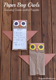 an owl made out of paper sitting on top of a wooden table next to a piece of paper