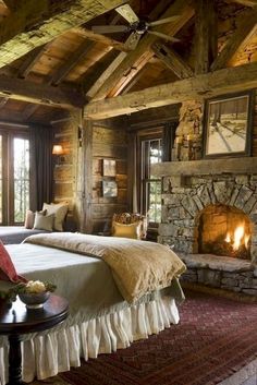 a bedroom with two beds and a fireplace in the corner on either side of the bed