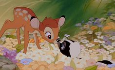 the fawns are kissing each other in front of flowers