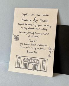 a wedding card with an image of a building on the front and bottom, in black ink