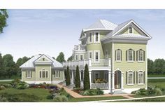 this is an artist's rendering of a two story house with porches and balconies