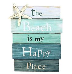 a wooden sign that says the beach is my happy place with a starfish on it