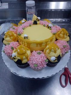 a cake decorated with yellow and pink frosting