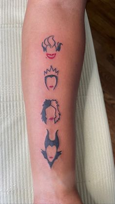 a woman's leg with three different tattoos on it