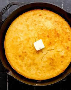 a skillet with some food in it on the stove top, ready to be cooked