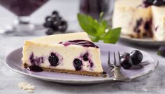 a slice of cheesecake with blueberries on a plate