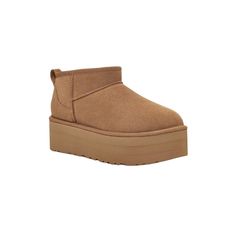 This platform ankle boot is one of our most precious styles, and oh, do we have the viral-status receipts to prove it. This ultra, elevated women's Classic Ultra Mini Platform Boot is a must-have combination of newness and nostalgia. It's made with rich suede and lined inside with our UGGplush™ blend for signature softness. Available in a range of dark and light neutral colors and blues.The outsole of this product is either a sugarcane EVA outsole, which is a responsible compound using sugarcane Holiday Wishlist, Cheer Girl, Magnetic Jewelry, Platform Ankle Boots, Vest Shirt, Prove It, Suede Ankle Boots, Platform Boots, Socks Women