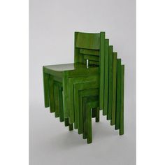 four green chairs stacked on top of each other