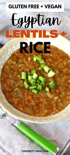 a bowl filled with lentils and rice next to a green spoon on a white towel