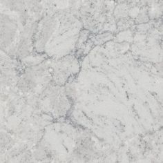 a white marble textured surface with grey veiners