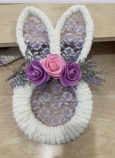 an easter bunny made out of crochet and flowers