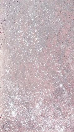 an aerial view of pink and silver glitters on a white background with space for text