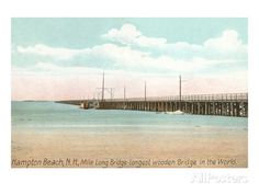 an old postcard shows a long pier in the ocean