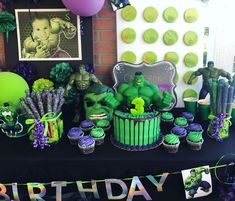 a birthday party with hulk cake and cupcakes