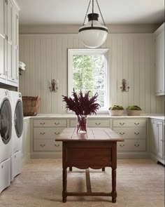 an image of a kitchen setting with washer and dryer in the background, on instagram