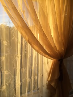 the curtains are open and ready for us to see in the window sill,