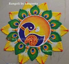 rangolii by sangeeta with peacocks and flowers on the front of it