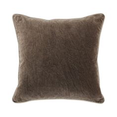 a brown pillow on a white background