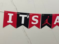 it's a basketball banner hanging on a wall