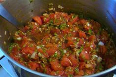 a pot filled with lots of food on top of a stove