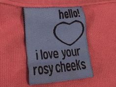 a label on a pink shirt that says hello i love your rosycheks