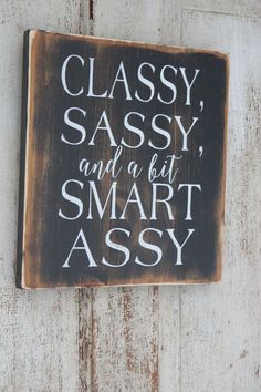 a sign that says classy sassy and a bit smart assy