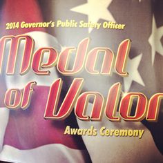 the medal of valor award ceremony is being held in front of an american flag and stars