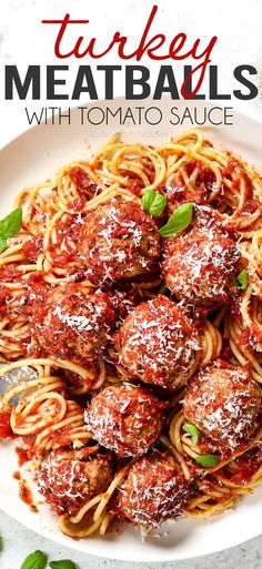 turkey meatballs with tomato sauce in a white bowl on a marble countertop and text overlay that reads turkey meatballs with tomato sauce