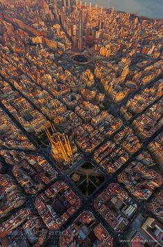 an aerial view of a city with lots of tall buildings