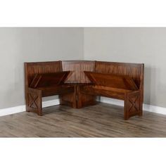 two wooden benches sitting next to each other on top of a hard wood flooring