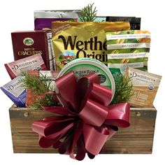 a wooden box filled with lots of different types of food and snacks on top of it