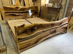 a bed made out of wood in a room