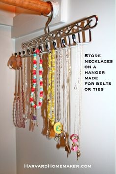 there is a rack with many necklaces hanging from it's sides and the words store necklaces on a hanger made for bells or ties