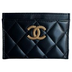 Chanel Black Leather Quilted CC Card Holder Made In: Spain Color: Black Hardware: Goldtone Materials: Lambskin leather Lining: Leather and grosgrain Four credit card slots Exterior Condition: Like new Interior Condition: Like new Includes: Box and pouch Measurements: 4.5" W x 3" H Button Closure Flap Card Holder Chanel With Pocket In Back, Xmas Gift Ideas, Chanel Black, Card Holder Wallet, Black Hardware, Small Accessories, Lambskin Leather, Designer Bags, Fashion Handbags