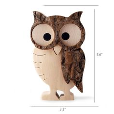 a wooden owl with big eyes is shown in front of a white background and measurements