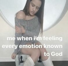 a woman sitting on top of a toilet with her arms around her body and the words, me when i'm feeling every emotion known to god